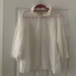 White blouse with ruffle collar